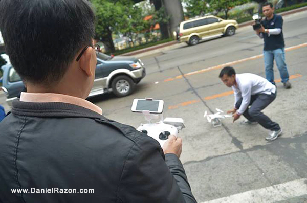 uya Daniel Razon preps one of UNTV’s news-and-rescue drones for its test flight. The drone is controlled by a remote device with a viewing panel for viewing through its camera.