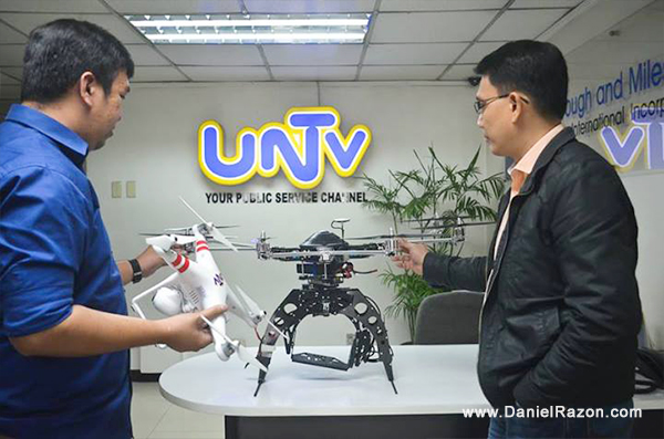 Kuya Daniel Razon (right) and UNTV Reporter Mon Jocson (left) looking at the UNTV drones to be used in the network’s news and rescue operations.