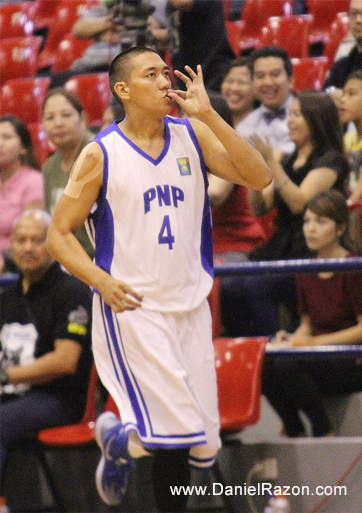 PNP sharpshooter Ollan Omiping making his trademark gesture after converting on a three-pointer in their game against the MMDA Black Wolves last Friday at the Ynares Sports Arena. PNP claims the win against MMDA, 75-61. (Rey Vercide | Photoville International)