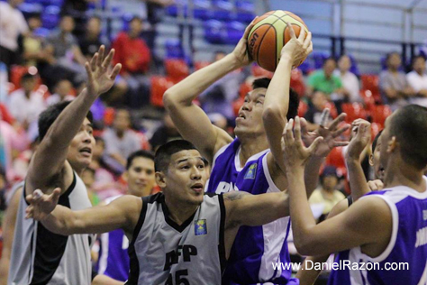 PNP center Jaymann Misola (Center-blue) forces his way to score underneath the basket against the frontline players of AFP. The Responders escapes the Cavaliers, 71-69. (Photo by: Prince Maverick Medina Marquez | Photoville International)