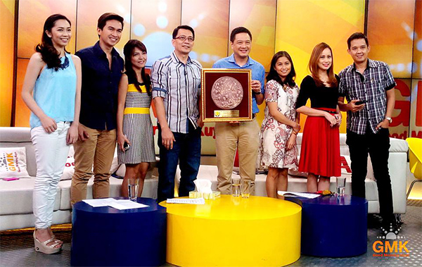 Good Morning Kuya! hosts pose for a picture with the Excellence in Journalism for Television award during one of the show’s live episode.