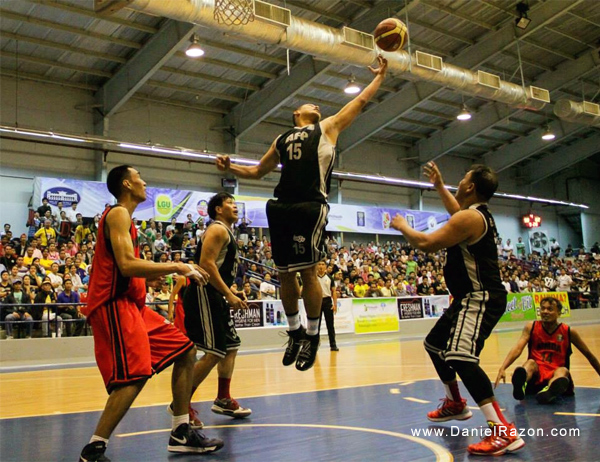 AFP's star forward Wilfredo Casulla (#15) grabs the rebound for the Cavaliers. AFP won against MMDA, 89-78.  (Prince Marquez / Photoville International)