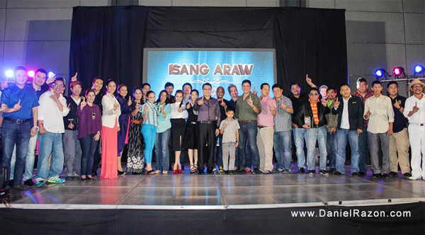 Isang Araw’s cast and crew pose for a group photo showing the Isang Araw hand sign during the production team’s thanksgiving event held at One Esplanade in Pasay City. (Prince Maverick Medina Marquez | Photoville International)