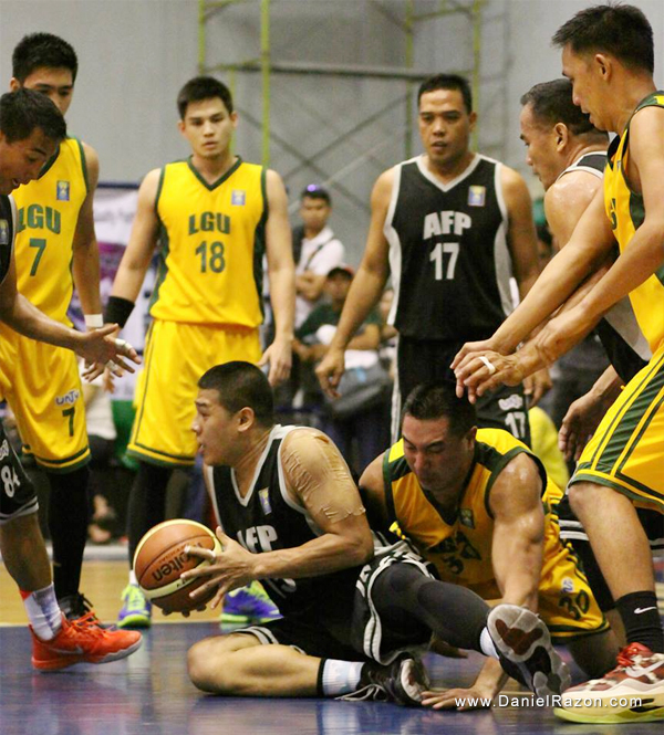 AFP forward Wilfredo Casulla and LGU center Francis Zamora dives on the floor to get the loose ball as their co-players look on. AFP won the nail biter match, 101-98. (Russel Julio | Photoville International)