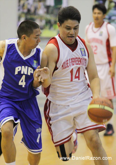 HOR reinforcement Gerard Francisco (right) drives against PNP’s Olan Omiping (left). Both players lead their teams to victory on Sunday as HOR faces PhilHealth in the first game while PNP faces the Senate Defenders in the third game. (Rey Vercide | Photoville International)