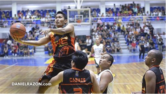 Don Conrad Macato (#7) goes to the hoop for a layup. (Photo by: Madz Milana, Photoville International)